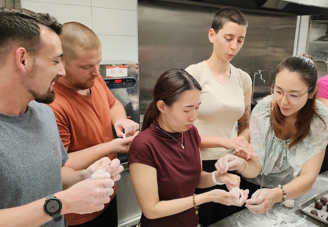 [Describe: e.g., 'Finished wagashi arranged on a black tray']